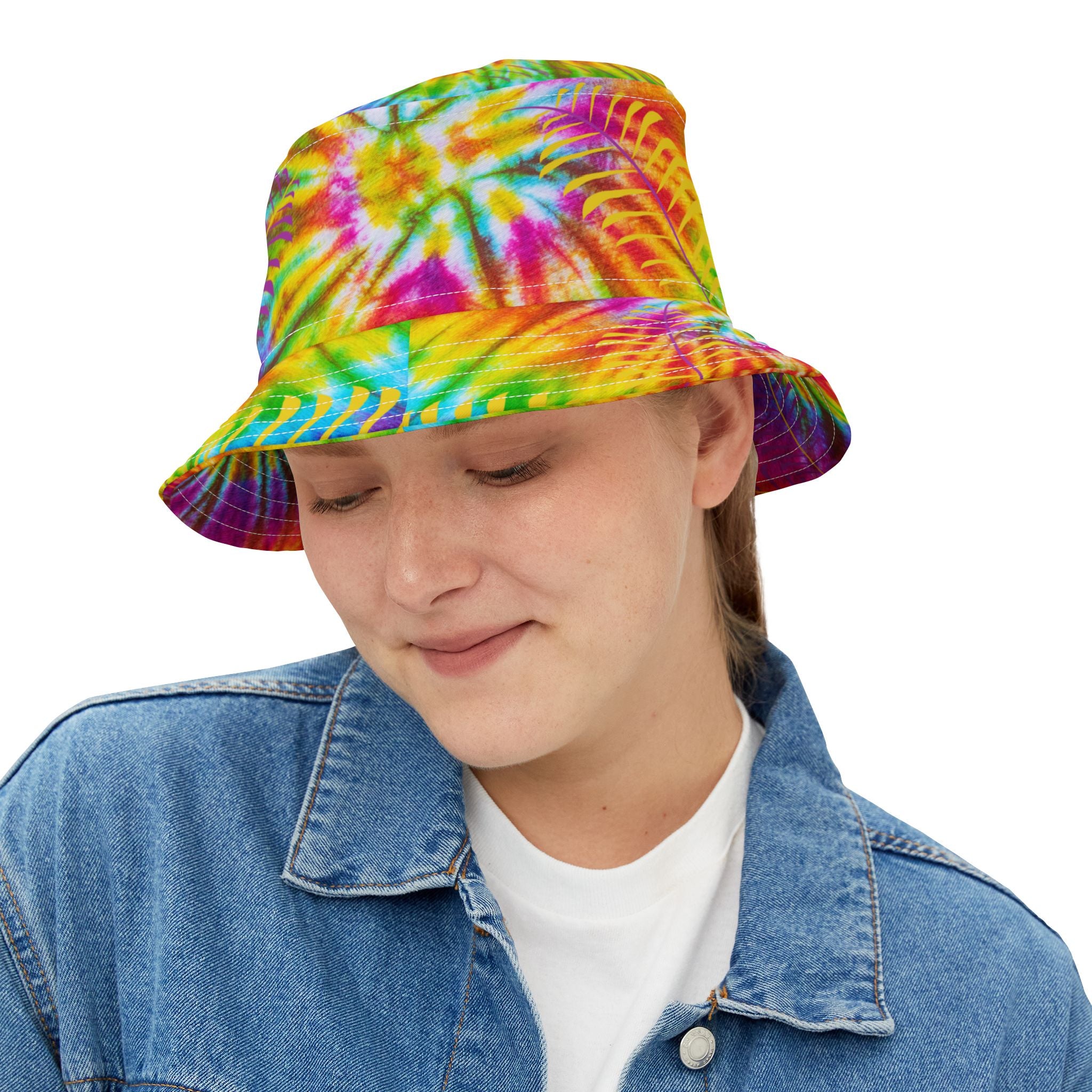 Person wearing a colorful tie-dye bucket hat on a white background